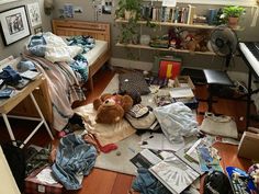 a messy bedroom with lots of clutter on the floor and stuffed animals in it