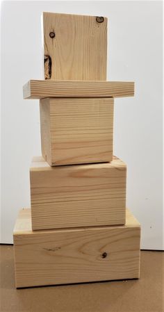 three pieces of wood stacked on top of each other