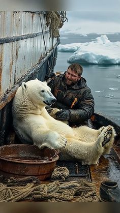 a man sitting on the back of a boat next to a polar bear