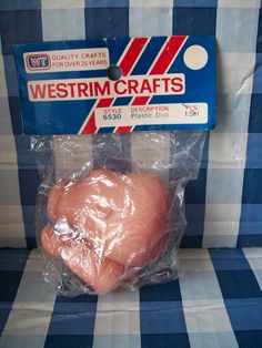 a package of meat sitting on top of a blue and white checkered table cloth