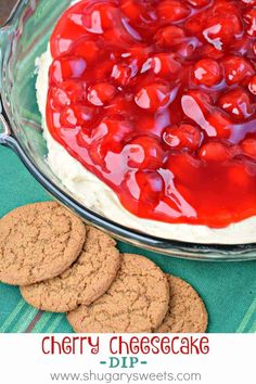 cherry cheesecake dip in a glass dish with cookies on the side and text overlay