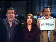 two men and a woman holding up a sign with the words aranhah on it