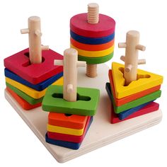 a wooden toy set with different colored blocks and pegs