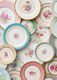 many different colored plates with flowers on them