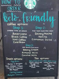 the menu for starbucks's coffee shop is displayed on a blackboard with blue writing