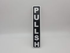 a black and white sign that says push