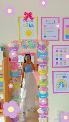 a woman taking a selfie in front of a mirror with decorations on the wall