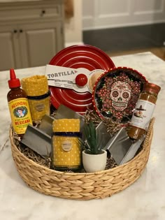 a basket filled with food and condiments on top of a counter