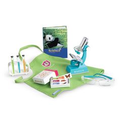 the science kit includes microscopes, books and other items