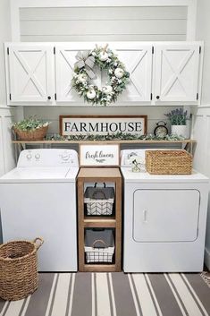 a white washer and dryer sitting inside of a laundry room