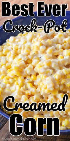 the best ever crock - pot creamed corn in a blue bowl on a wooden table