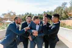 a group of men standing next to each other