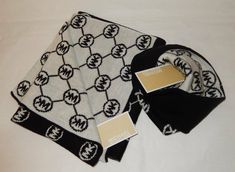 AUTHENTIC MICHAEL KORS, LOGO 2 PCS. SCARF & HAT SET-BLK/WHT MICHAEL KORS WOMENS 2 PC. LOGO  SIGNATURE MK LOGO IN CIRCLES STATED THROUGHOUT SCARF. COMES IN A GIFT BOX  SCARF & HAT. COLOR OF SCARF AND HAT ARE BLACK WITH SIGNATURE MK  IN WHITE. APPROX. MEASUREMENTS OF SCARF:  10 INCHES WIDE BY 64 INCHES LONG. ONE SIZE FITS ALL HAND WASH ONLY Pc Logo, Scarf And Hat, Michael Kors Logo, Mk Logo, Hat Set, Scarf Hat, One Size Fits All, Scarf Wrap, Circles