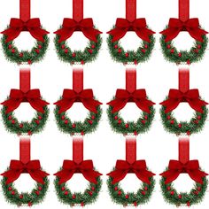 twelve christmas wreaths with red bows and holly - berry decorations on white background photo