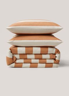 four pillows stacked on top of each other