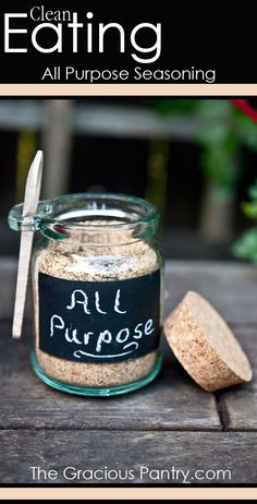 a jar filled with all purpose seasoning sitting on top of a wooden table