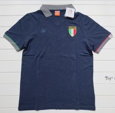 a polo shirt with the italian flag on it and a name tag hanging from the collar