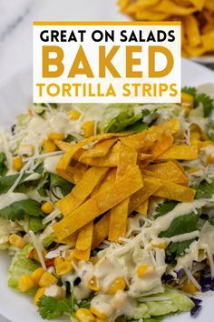 a white plate topped with salad covered in tortilla strips