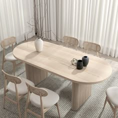 a table with chairs around it and a vase on the table in front of it