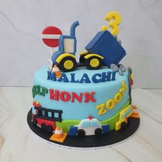 Blue iced birthday cake with handmade 3D fondant edible dumper truck on top and fondant vehicles around the side Lorry Birthday Cake, Vehicle Cakes For Boys, Vehicles Cake 2nd Birthday, Police Car Cake Design, Police Car Cakes, Car Theme Birthday, Birthday Cake With Fondant, Truck Birthday Cake, Truck Birthday Cakes