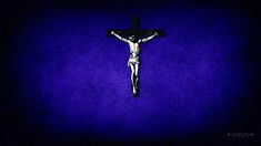 the crucifix is shown against a purple background