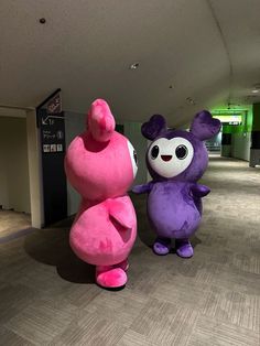 two inflatable characters standing next to each other