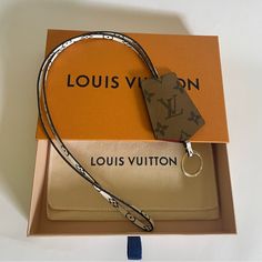 Excellent Lightly Used Condition Louis Vuitton Key Lanyard Clochette In Giant Reverse Monogram. Can Be Used For Keys Or As A Badge Holder. Wear Around The Neck, Looped Onto Belt, Or Looped Onto Handbag Handle As A Decorative Accessory. Includes Dust Cover, Box, And Receipt Pictured. Key Lanyard, Handbag Handles, Louis Vuitton Accessories, Badge Holder, Dust Cover, Badge Holders, Lanyard, Decorative Accessories, Louis Vuitton