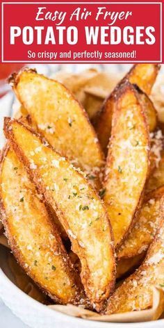 fried potato wedges in a white bowl with parmesan cheese on the side