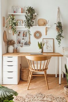 a wooden desk topped with lots of plants