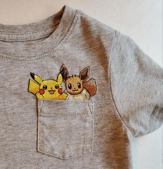 a pocket t - shirt with pokemon and pikachu on it