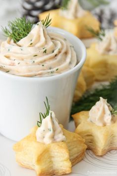 a white plate topped with food next to pine cones