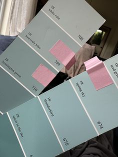 some blue and pink paint swatches are stacked on top of each other