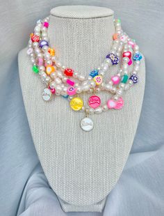 🙂 Sweet Lovin' Necklace 🙂 If pearls are anyone's best friend, this necklace would become your new go to everyday. With a mix of white pearls, freshwater pearls, colorful clay beads in different shapes and a delicate gold filled and enamel charm this necklace is here to brighten your outfit. The "Candy Crush" collection is meant to be for anyone who likes to have a classy yet fun style! Materials: Beaded pearls, freshwater pearls, clay beads  14k Gold filled and enamel charm 18K Gold Filled loc Playful White Jewelry With Charms, Adjustable White Charm Necklaces With Letter Beads, Cute White Jewelry With Charms, White Adjustable Charm Necklace With Letter Beads, Whimsical White Jewelry With Pearl Charm, Trendy White Pearl Necklace With Heart Beads, White Charm Necklace With Pearl And Round Beads, Handmade White Pearl Charm Necklaces, Cute Handmade White Charm Necklaces