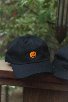 Inspired by the simple pumpkin designs of 90's Halloween info: 6 panel baseball cap (Dad Hat), adjustable sizing Fun Streetwear Dad Cap, Fun Curved Brim Baseball Cap For Streetwear, Fun Dad Hat For Streetwear, Fall Streetwear Baseball Cap With Curved Brim, Black Snapback Cap For Halloween, Streetwear Fall Baseball Cap With Curved Brim, Halloween Snapback Baseball Cap, Casual Halloween Cap, Halloween Snapback Baseball Cap For Streetwear