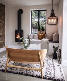 a living room filled with furniture and a fire place on top of a wooden table