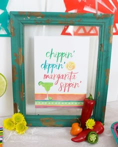 there is a framed sign that says chippin'dippin and margarita sippin