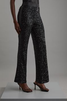 Experience Elevated Tailoring In A Pair Of Wide Leg Trousers, Featuring A Flattering, Relaxed Fit And A Comfortable High Waistline. The Sparkling Sequisn Make These Trousers An Instant, Party Ready Statement. Style With The Matching Shirt For A Co-Ordinating, For A Formal Look, Or With A T-Shirt And Trainers For A More Laid Back Approach. Sequin High Waist Wide Leg Trousers High Quality Stretch Fabric With Sparkling Sequins Comfortable High Waistline Flattering Wide Leg Fit Sleek, Minimal Design Black Sequined Straight Leg Pants, Glamorous Fitted Straight Leg Pants, Elegant Sequined Bottoms For Evening, Elegant Straight Leg Bottoms With Sequins, Elegant Straight Leg Sequin Bottoms, Elegant Straight Pants With Sequins, Elegant Sequined Straight Pants, Straight Leg Sequin Pants For Evening, Sequin Straight Leg Evening Pants