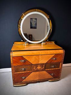 an old dresser with a mirror on top