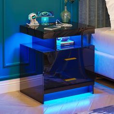 a night stand with blue lights on it