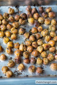 roasted chickpeas on a baking sheet ready to be cooked in the oven for roasting