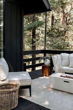 a white couch sitting on top of a wooden deck