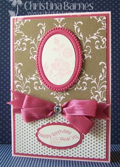 a close up of a birthday card with a pink ribbon on the front and bottom