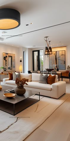 a living room filled with white furniture and lots of windows on top of each other