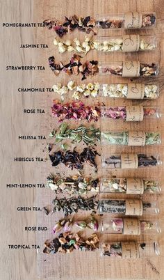 a table topped with lots of different types of teas and seasonings on top of each other