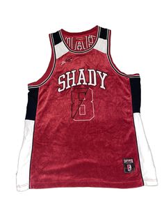 Tag says medium, definitely a lot bigger than a medium. Buyers discretion is advised furthermore, measurements taken with a ruler. Has loose strands here and there with minor marks and scuffs. Free ship! Looking for a vintage and rare jersey shirt that embodies the 90s rap? Look no further than this Shady Limited Limited Edition Series 1 Jersey Shirt. This pullover style jersey is perfect for men who want to relive the golden era of hip hop. The shirt is in pre-owned condition, with size 2XL, an Eminem Shirt, Eminem Style, 90s Rap, 2000s Streetwear, Vintage Jerseys, Outfits Dress, Shirt Y2k, Golden Era, 90s 2000s