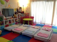 a child's room with colorful carpeting and lots of toys