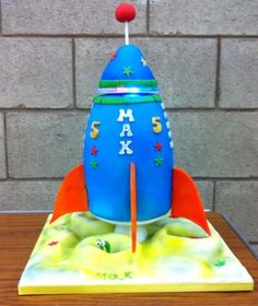 a cake shaped like a rocket ship on top of a table