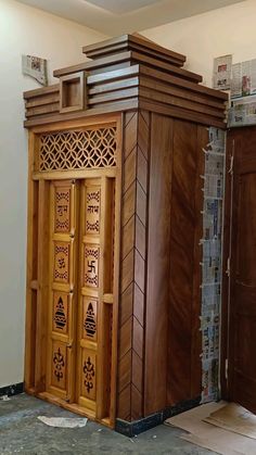 two wooden doors are next to each other in a room with tile flooring and walls