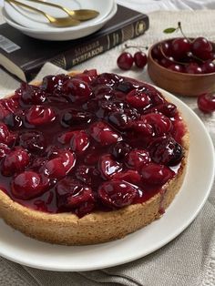 a cherry cheesecake on a white plate