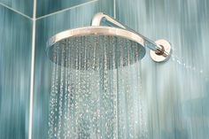 a shower head with water running down it